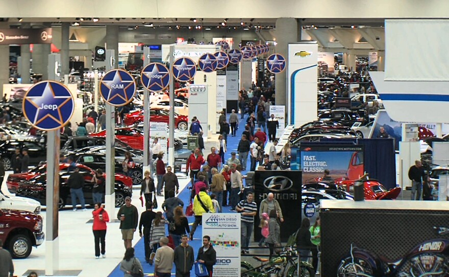 Visitors are shown at the San Diego Auto Show on Jan. 2, 2015.