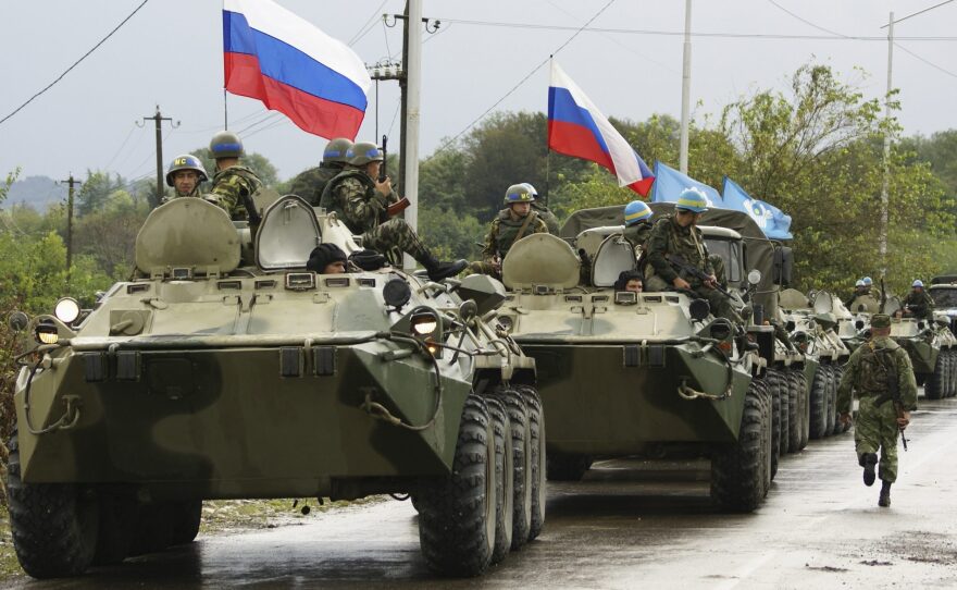 A column of Russian troops prepares to leave the checkpoint at a bridge over the Inguri River in Western Georgia, in October 2008, after securing the secession of Georgia's breakaway South Ossetia region.
