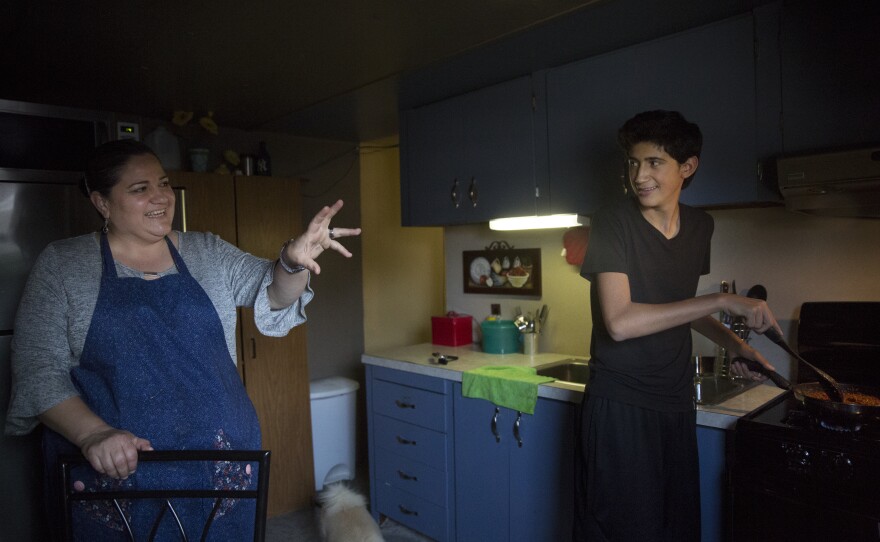 Angel and his mom, Aracely, cook dinner after school.