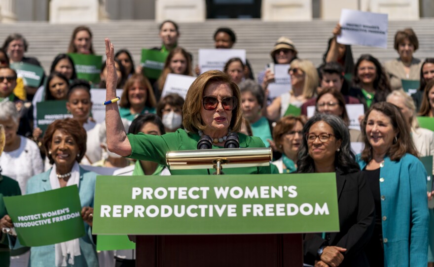 House Speaker Nancy Pelosi of Calif., accompanied by female House Democrats, speaks at an event ahead of a House vote on the Women's Health Protection Act and the Ensuring Women's Right to Reproductive Freedom Act at the Capitol in Washington, Friday, July 15, 2022.