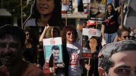 Relatives and supporters of Israeli hostages held by Hamas in the Gaza Strip hold posters with portraits of their loved ones during a protest demanding their immediate release and calling for a ceasefire, in Jerusalem, Tuesday, Oct. 7, 2025, on the second anniversary of Hamas' cross-border attack on Israel on Oct. 7, 2023, which sparked the ongoing war in Gaza.