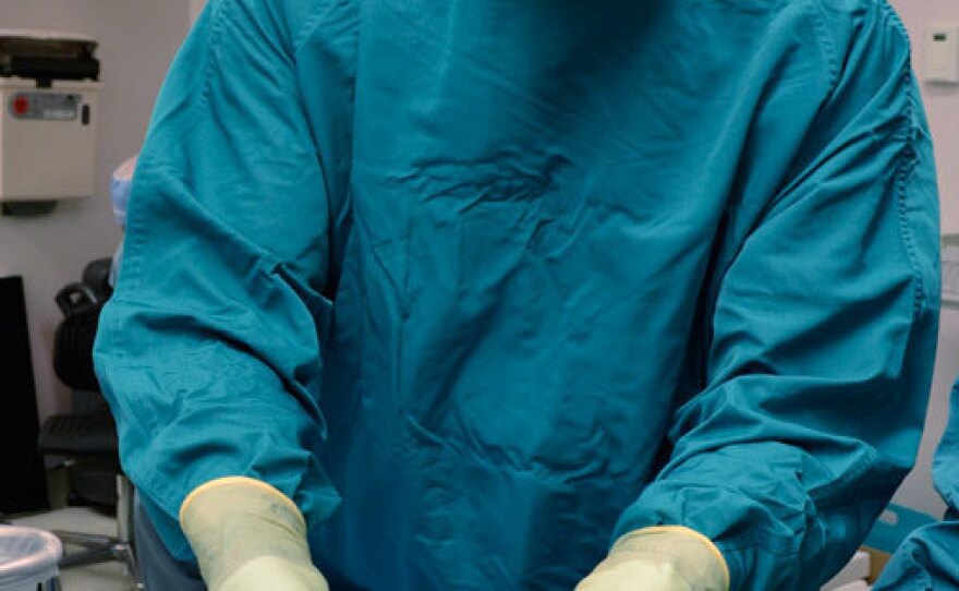 Steven Parnis, assistant director of technology development at the Texas Heart Institute, prepares the pair of ventricular assist devices for surgery. These devices use spinning rotors to circulate blood, instead of rhythmic contractions.