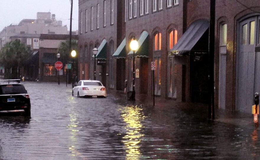 Flood waters rose near Charleston, S.C.'s popular City Market Saturday, as Hurricane Matthew neared. The storm could bring flash floods and a surge of between six and nine feet, forecasters say.