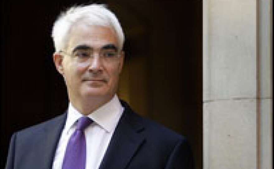 British finance minister Alistair Darling leaves a television studio in London on Wednesday, when Britain's government announced that it would use taxpayers' money to buy major stakes in the country's eight main banks to prevent a collapse of the banking system.