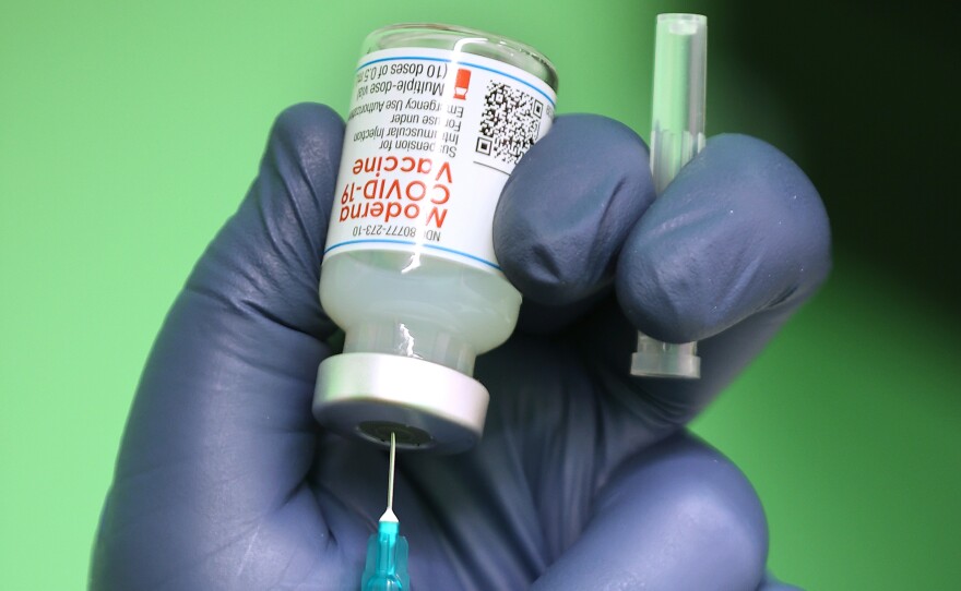 Moderna says clinical trials showed its COVID-19 vaccine is effective for children from age 12 to 17, with mostly mild or moderate side effects. Here, a syringe is filled with a dose of the Moderna coronavirus vaccine in Wheaton, Md.