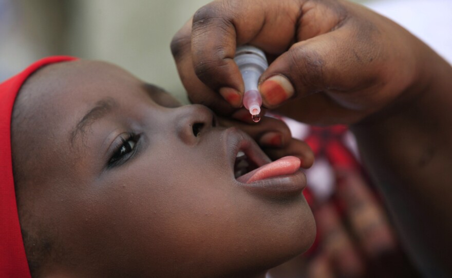 A child receives a polio vaccine Sunday in Kano, Nigeria. The country is the primary source of the virus in Africa but appears to be making progress against the disease; the current outbreak in Cameroon that has spread to Equatorial Guinea came by way of Chad, not Nigeria.