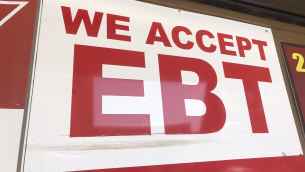 An sign displaying "We Accept EBT" is hung outside of a store in City Heights, in this undated photo.