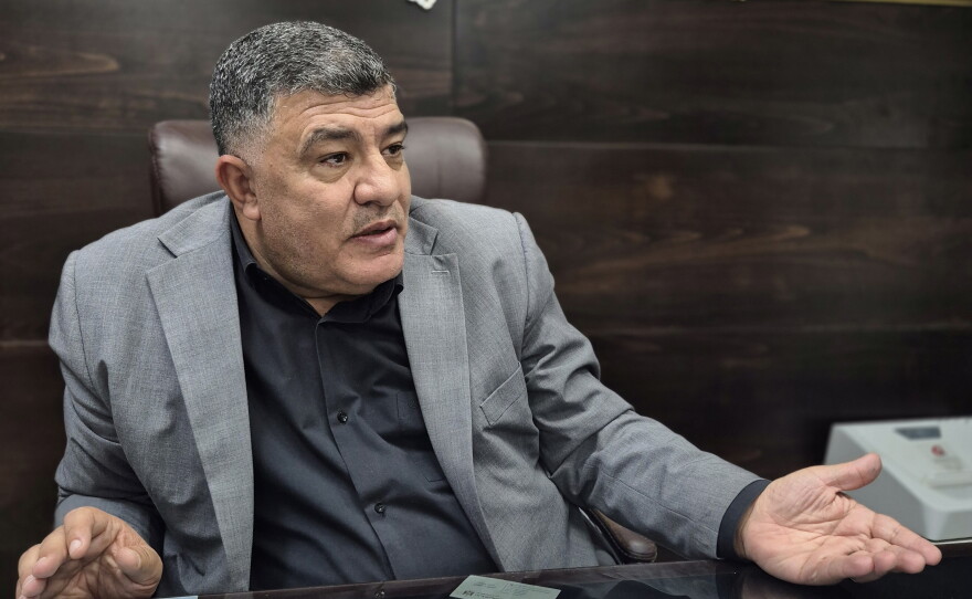 Ghassan Daghlas, the governor of Nablus, in his office.