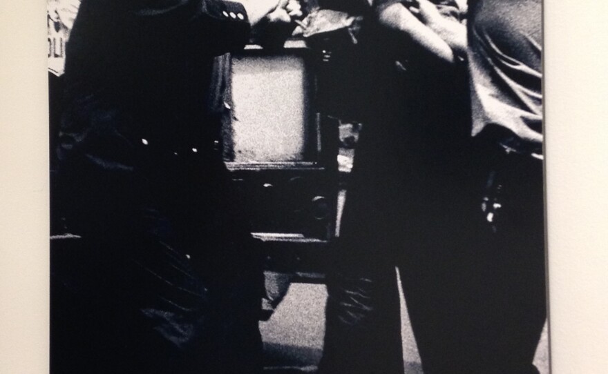 A member of the Young Lords with blood on his face is arrested by police. Bolivar Arellano took this photo, now on display at Columbia University, in 1971.