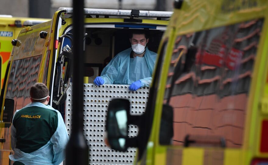 Paramedics prepare an ambulance outside the Royal London Hospital in East London on Friday. London Mayor Sadiq Khan has declared a 'major incident,' warning that hospitals in the British capital could soon be overwhelmed after a surge in coronavirus infections.