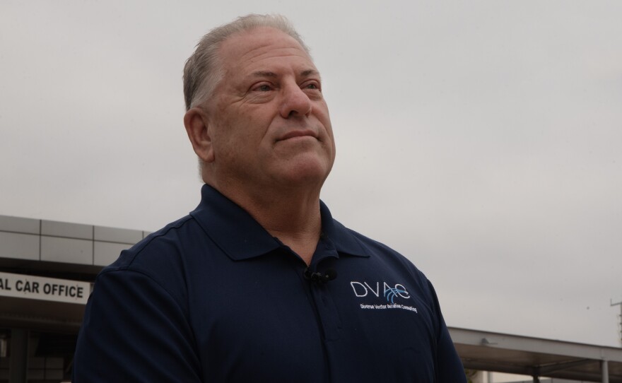 Former air traffic controller Kevin Karpé stands in front of the McClellan-Palomar Airport in Carlsbad, Oct. 8, 2025.