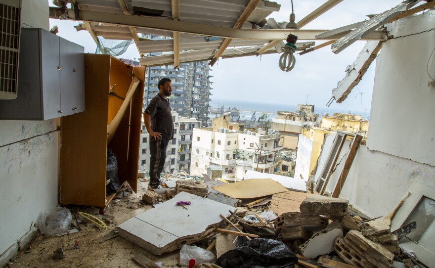 Habeb al-Hamad Azab, a Syrian refugee, stands in front of his destroyed home in Beirut's Mar Mikhael neighborhood.