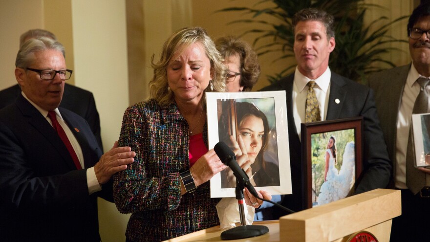 Debbie Ziegler holds a photo of her late daughter, Brittany Maynard, while speaking to the media in September after the passage of California's End Of Life Option Act. Maynard was an advocate for the law.