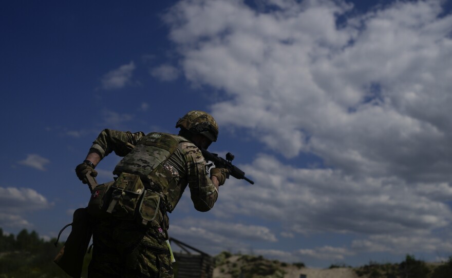 A civilian militia member holds a rifle during training at a shooting range on the outskirts of Kyiv on Tuesday.