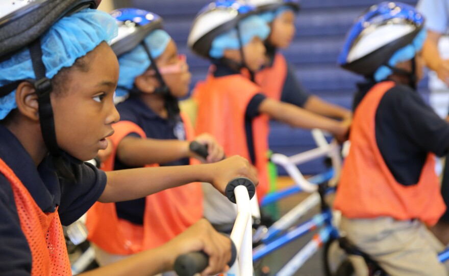 Lachae' Taylor gears up to ride in David Gesualdi's gym class at Walker-Jones Education Campus in Washington, D.C.