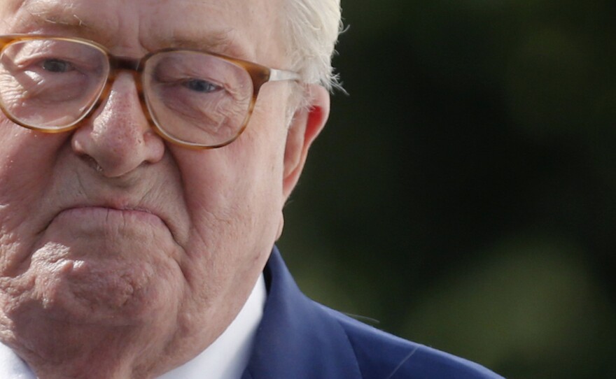 French far-right National Front founder Jean-Marie Le Pen arrives for a news briefing at the end of a hearing of the executive committee of the party at their headquarters in Nanterre, near Paris, on Thursday. The committee decided to expel from the party over remarks downplaying the Holocaust.
