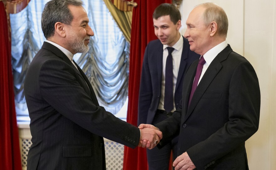 Russian President Vladimir Putin (right) shakes hands with Iranian Foreign Minister Abbas Araghchi during their meeting at the Boris Yeltsin Presidential Library, in St. Petersburg, Russia, Monday.