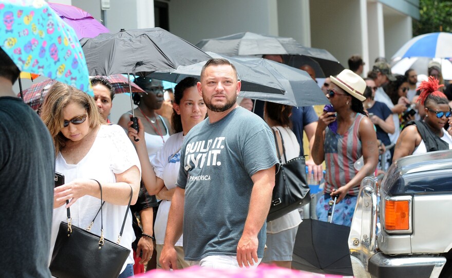 People wait in line to donate blood at the OneBlood Donation Center in Orlando, Fla, on Sunday, after a mass shooting at a gay nightclub left at least 50 people dead and 53 injured.