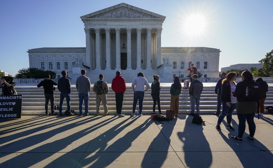 Anti-abortion rights activists demonstrate at the Supreme Court in Washington on Oct. 5. The court's new conservative supermajority puts the fate of Roe v. Wade in doubt.