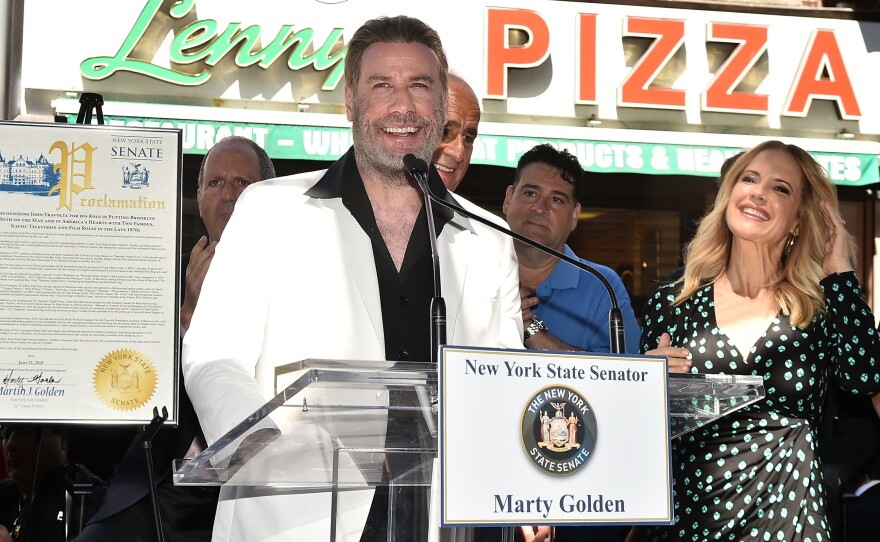 John Travolta is honored at Lenny's Pizza in Brooklyn on "John Travolta Day."