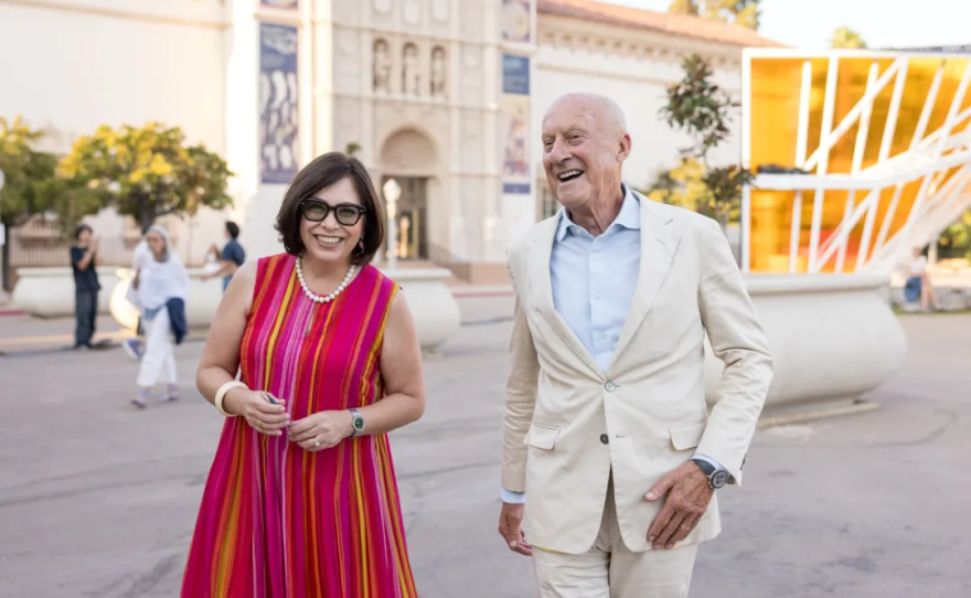 San Diego Museum of Art executive director and CEO Roxana Velásquez (left) walks alongside architect and Foster+Partners founder Norman Foster in Balboa Park, Sept. 9, 2024.