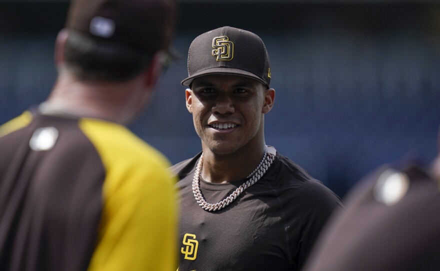 San Diego Padres right fielder Juan Soto talks with manager Bob Melvin during batting practice before the the team's baseball game against the Colorado Rockies on Wednesday, Aug. 3, 2022, in San Diego. 