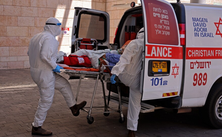 Medics in Jerusalem transferred a COVID-19 patient to Hadassah Hospital Ein Kerem. Many hospitals in Israel were at full capacity this summer following a sharp increase in coronavirus infections.