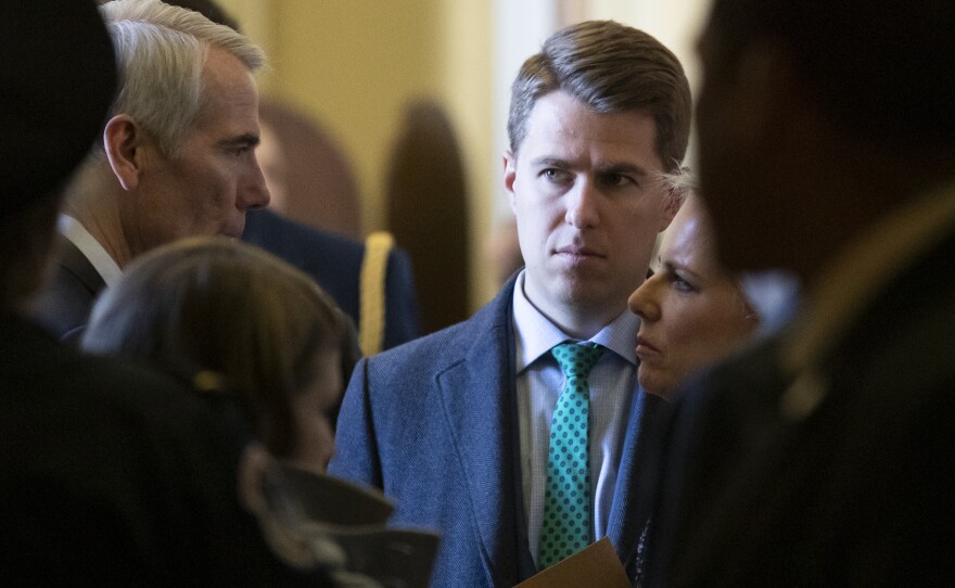 Miles Taylor (center) departs after the Republican Caucus luncheon on Capitol Hill in Washington in March 2019. Miles Taylor is among a group of conservatives imploring the "rational remnants of the Republican Party" to join forces with Democrats to defeat those who've "turned belief in conspiracy theories and lies about stolen elections into a litmus test for membership and running for office."