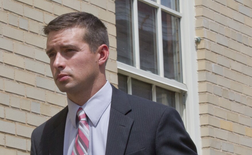 Eric Parker walks into a federal courthouse, Tuesday, Sept. 1, 2015, in Huntsville, Ala. Parker is on trial on a federal charge of using excessive force against an Indian man, Sureshbhai Patel, who was thrown down seriously injured during a confrontation in February.