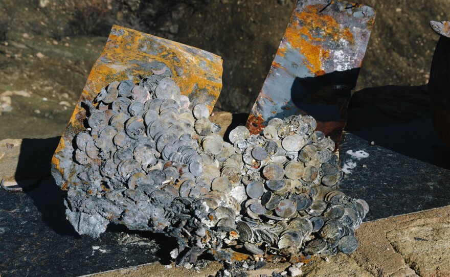Coins melted together on Jones' property. He had a pot of coins for his grandchildren to pull from when they visited.