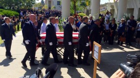 The casket of Jonathan De Guzman is carried inside of Corpus Christi Catholic Church in Bonita, Aug. 4, 2016.