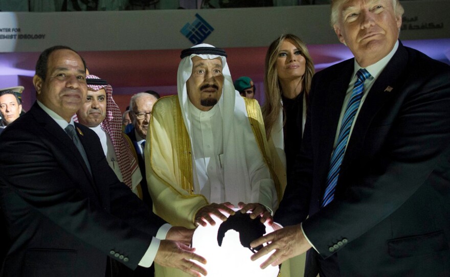 In this 2017 file photo from the Saudi Press Agency, Egyptian President Abdel Fattah al-Sissi, Saudi King Salman, and former President Donald Trump open a center to combat extremism in Riyadh.