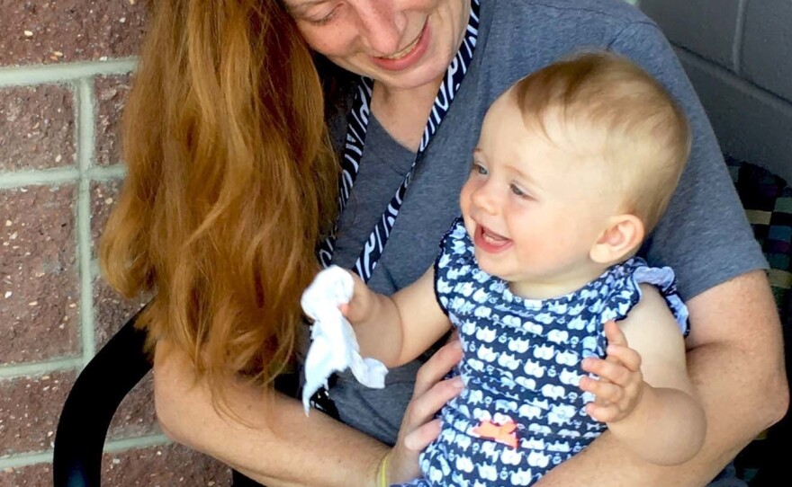 Renee Miller plays with her 11-month-old daughter, Ariana, at the Hospitality House in Boone, N.C.