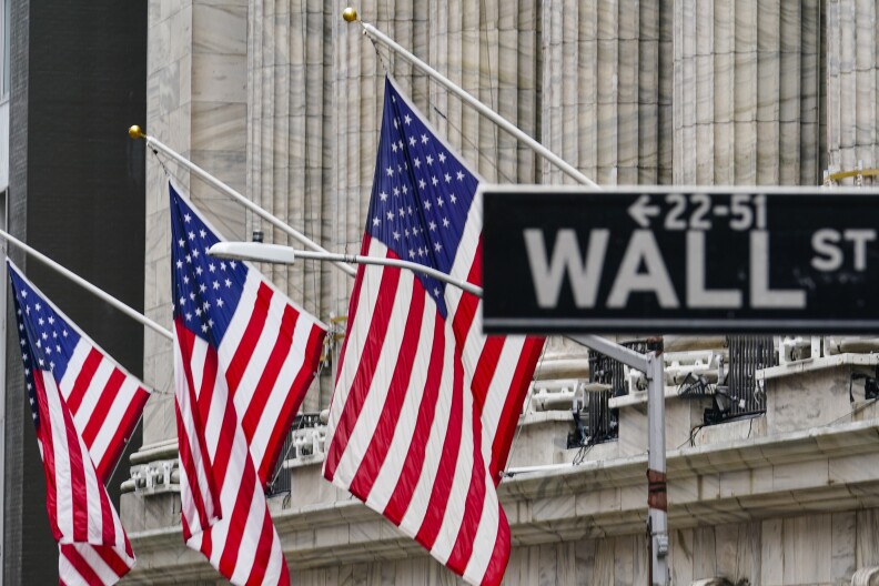 American flags hang outside of the New York Stock Exchange, in this Tuesday, Feb. 16, 2021, file photo.