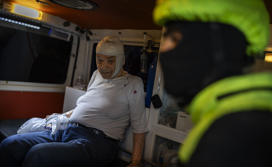 An injured civilian is transferred by ambulance from Nabatieh' hospital to a hospital in Sidon on May 14.