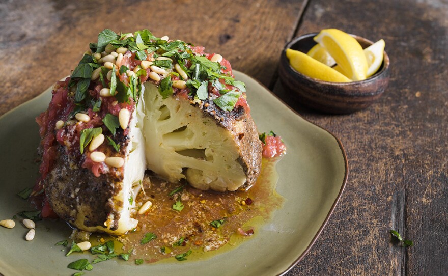 A whole Cauliflower with Spiced Tahini and Garlic-Chili Oil