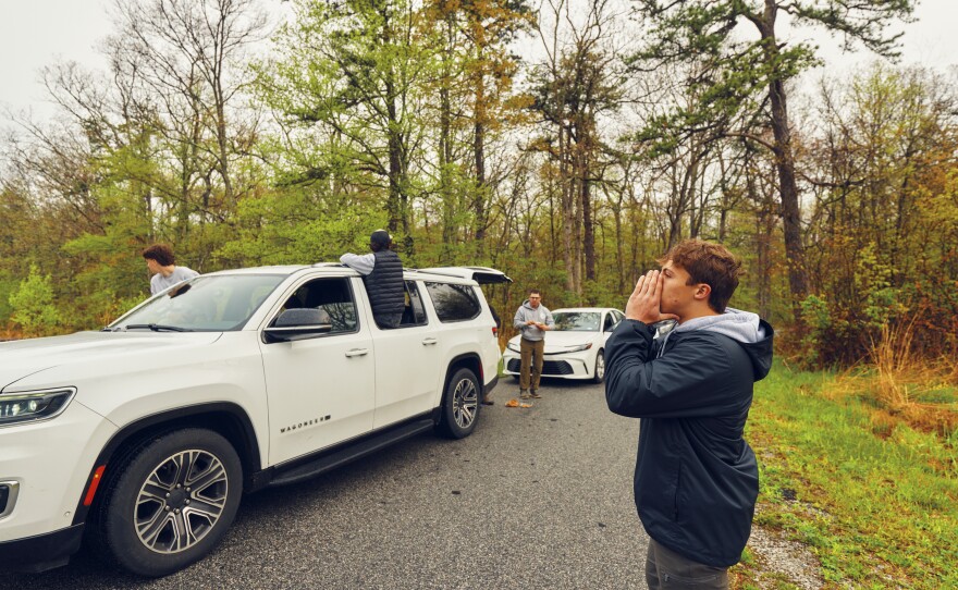 Trojan (right), makes bird calls at High Point State Park in northern New Jersey.