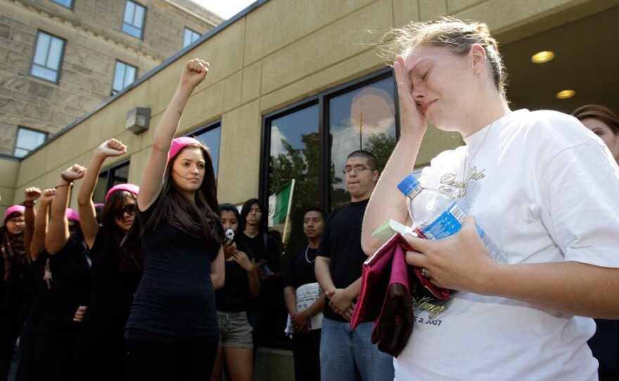 Crystal Dillman, the fiancee of Luis Ramirez, who was beaten to death, is moved to tears as members of Latina, a Chicago-based organization working to defend Latino immigrant rights, show support outside the courthouse in Pottsville, Pa., last year.