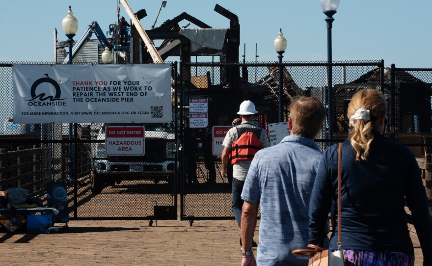 The west end of the Oceanside pier is still closed to the public during the demolition of the fire-damaged structure that once housed Ruby's Diner on Oct. 23, 2024.