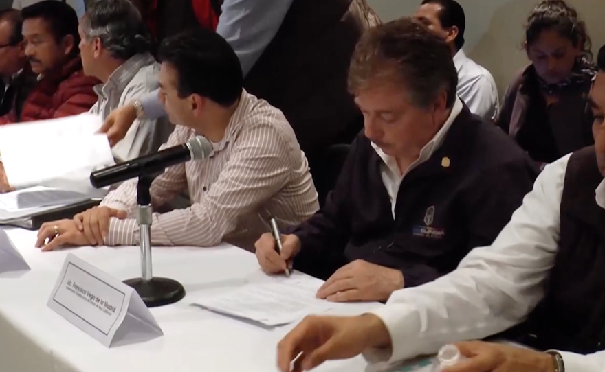 The governor of Baja California, Francisco Vega de Lamadrid, signs an agreement with farmworkers, May 13, 2015.