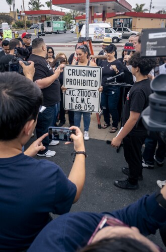 United Lowrider Coalition celebrates the revival of National City’s last “Cruising Prohibited” signs, May 19, 2023.