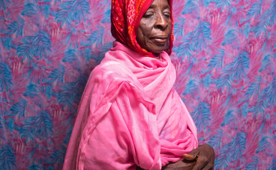 Falmata Ahmoduram, 70, is from Baga, a Nigerian fishing community near the border with Chad. She was displaced by fighting; her husband and one son went missing. Her five other children previously died of disease or natural causes. She now cares for her four grandchildren: "These grandchildren are all that I have."