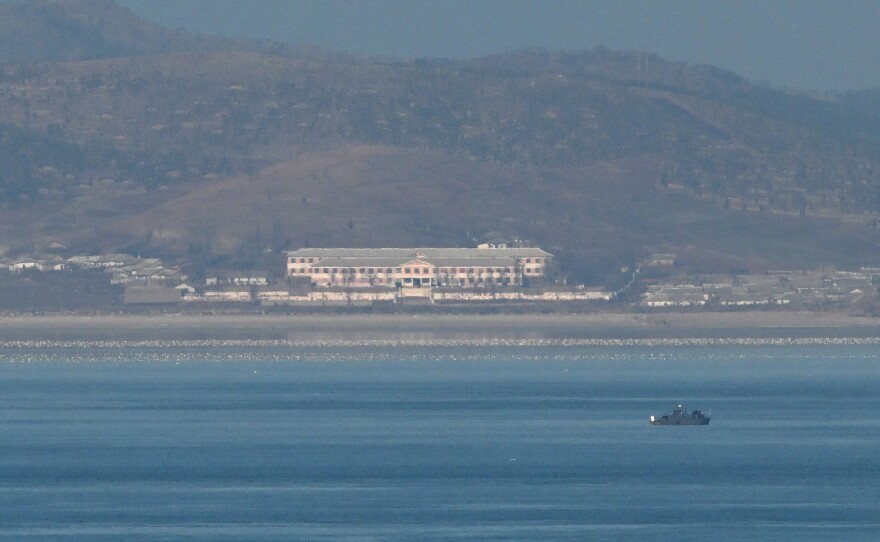 A general view shows an unidentified boat before the North Korean coastline as seen from a viewpoint on Yeonpyeong Island, near the Northern Limit Line sea boundary with North Korea, on Jan. 6.