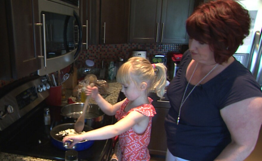 Sherri Erkel, right, and her daughter, Asa, cook dinner in their kitchen in Iowa City, Iowa. The Erkel family is part of an EPA study measuring the amount of food wasted in U.S. homes.