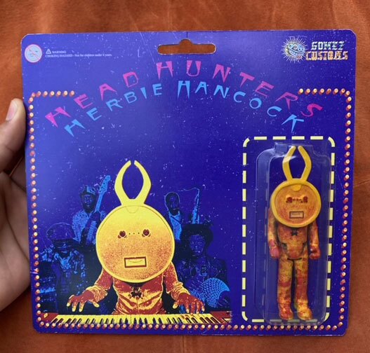 Artist Marino Gomez's custom art toy is an interpretation of Herbie Hancock's album art for "Head Hunters."