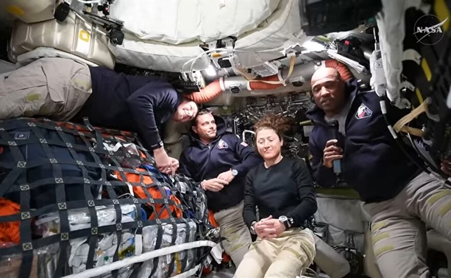 The four members of NASA's Artemis II crew (from left to right), Jeremy Hansen, Reid Wiseman, Christina Koch and Victor Glover, answer media questions from space during a news conference as they journey to the moon.