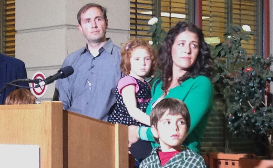 Sofia Jarvis, seen here with her family at a press conference in February, is one of several dozen children in California who have been diagnosed with a rare paralytic syndrome. It has left her left arm paralyzed.