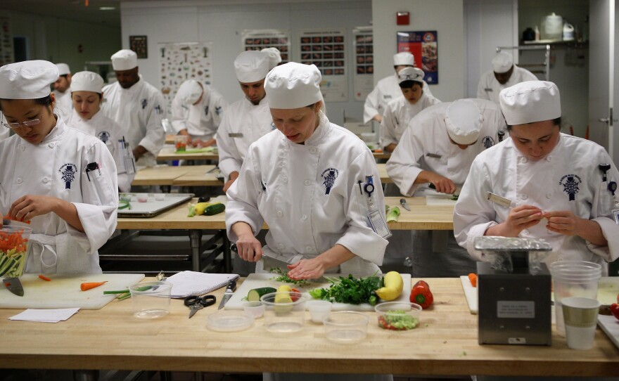 Students prep vegetables at the California Culinary Academy in April 2009 in San Francisco, Calif. The Le Cordon Bleu affiliate is among 16 schools due to close after graduating their final classes due to start in January.