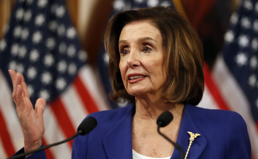 Speaker Nancy Pelosi speaks before she signs the Coronavirus Aid, Relief, and Economic Security (CARES) Act after it passed the House on March 27.