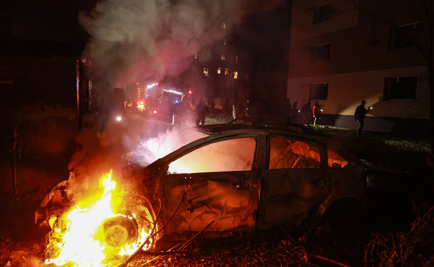 A car burns after a Russian airstrike on a residential neighborhood in Zaporizhzhia, Ukraine, on Saturday.